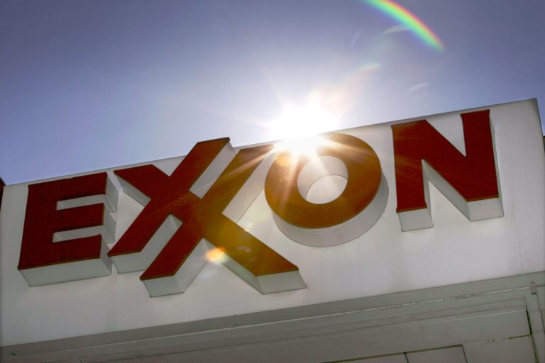 Exxon Mobil says the drive for higher living standards around the world will keep demand for electricity and transportation fuels growing even as economies get more efficient and governments put a price on pollution. (AP Photo/LM Otero, File)