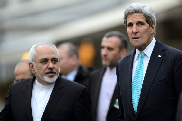Secretary of State John Kerry, right, speaks with Iranian Foreign Minister Mohammad Javad Zarif as they walk in the city of Geneva, Switzerland, Wednesday, Jan. 14, 2015, during a bilateral meeting ahead of the next round of nuclear discussions. (AP Photo/Keystone,Martial Trezzini)