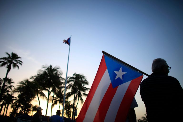The issue of Christmas bonuses touches on one of Puerto Rico's main problems: Its high cost of employment. (AP Photo/Ricardo Arduengo, File)
