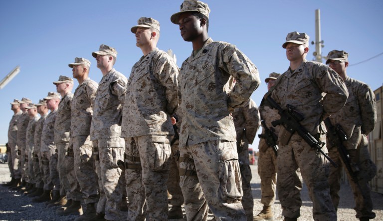 U.S. Marines stand guard during the change of command ceremony at Task Force Southwest military field in Shorab military camp of Helmand province, Afghanistan, Monday, Jan. 15, 2018. (AP Photo/Massoud Hossaini)