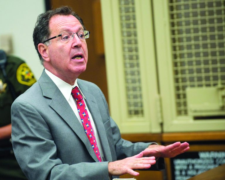 Ron Cordova, lawyer for Rainer Reinscheid, speaks during the arraignment of his client at the Harbor Justice Center in Newport Beach, Calif. on Wednesday, Aug. 8, 2012. An amended complaint issued Wednesday charged Reinscheid with eight counts of arson and one count of attempted arson for a series of small fires at the park where his son hanged himself in March, the high school and the home of a school administrator who had disciplined his son. (AP Photo/The Orange County Register, Paul Bersebach, Pool)