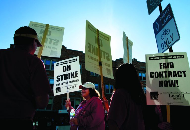 Public school teachers picket outside Amundsen High School in Chicago on the first day of a strike by the Chicago Teachers Union, Monday, Sept. 10, 2012. The school is one of more than 140 schools in the Chicago Public Schools' 