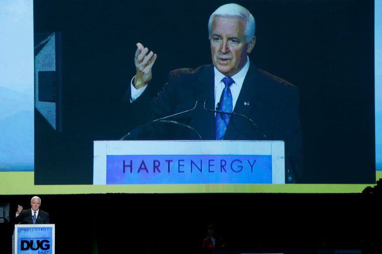 An image of Pennsylvania Gov. Tom Corbett is projected above him as he addresses the Developing Unconventionals East Conference on Thursday, Nov. 14, 2013, in Pittsburgh. The conference, known as DUG East, focuses on developments in producing natural gas and oil from the Marcellus and Utica shale rock formations. Corbett said the Marcellus Shale Development in the state employs thousands of Pennsylvanians and has reduced energy costs. (AP Photo/Keith Srakocic)