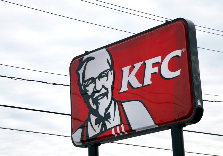 In this  Friday, Jan. 31, 2014, photo, a KFC sign hangs in Saugus, Mass. Fast-food conglomerate Yum! Brands, Inc., headquartered in Louisville, Ky., will report its fourth-quarter and annual earnings on Monday after markets close. (AP Photo/Elise Amendola)