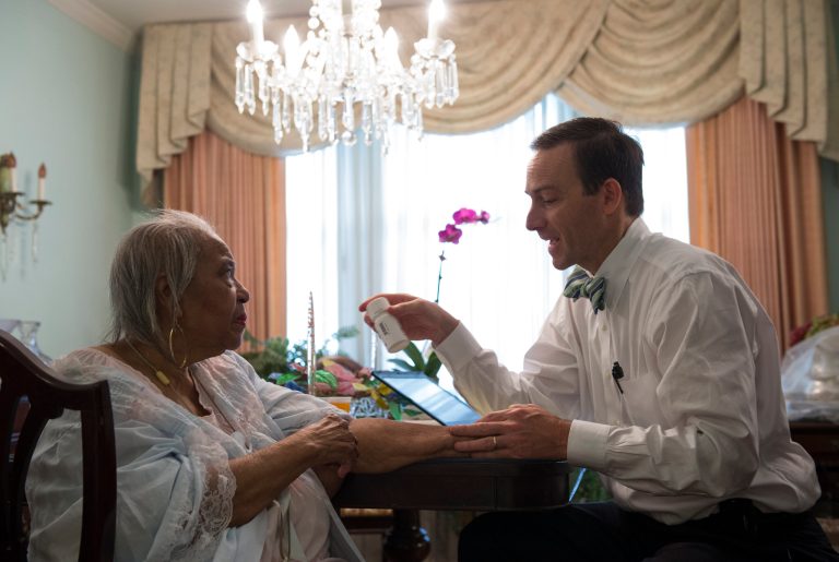 Dr. Eric De Jonge of Washington Hospital Center conducts a Medicare house call at the home of patient Beatrice Adams, in Washington, Thursday, Aug. 7, 2014. (AP Photo/Molly Riley)