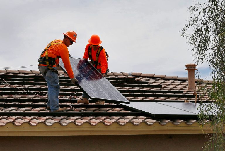 The rooftop solar panel industry is starting to resemble something more akin to a conventional power plant utility than a fledgling outlier, and is growing in scale and market strength. (AP File Photo/Matt York)