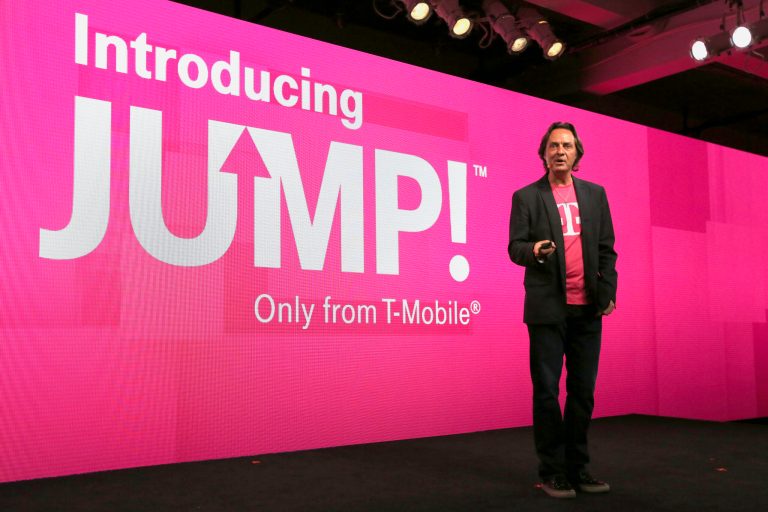 FILE - In this Wednesday, July 10, 2013, file photo, T-Mobile CEO John Legere speaks during news conference, in New York. T-Mobile says it will let people upgrade phones more quickly for a $10 monthly fee. With the new Jump plan, a customer will be able to get a new phone if the old one malfunctions or gets lost, or even if there's a better phone that comes out. The plan lets customers upgrade up to twice a year. Rivals typically allow upgrades after about two years. (AP Photo/Mary Altaffer)
