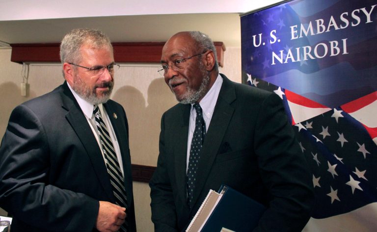   Assistant Secretary of State for African Affairs Johnnie Carson, center, speaks with U.S. Ambassador to Kenya Scott Gration, left, at a hotel in Nairobi, Kenya Sunday, June 10, 2012 shortly after Carson returned from a trip to Mogadishu, Somalia. The highest ranking U.S. official to visit Somalia's capital in years landed in Mogadishu on Sunday in another sign of improving security in the Horn of Africa's most chaotic nation. (AP Photo/Jason Straziuso)  