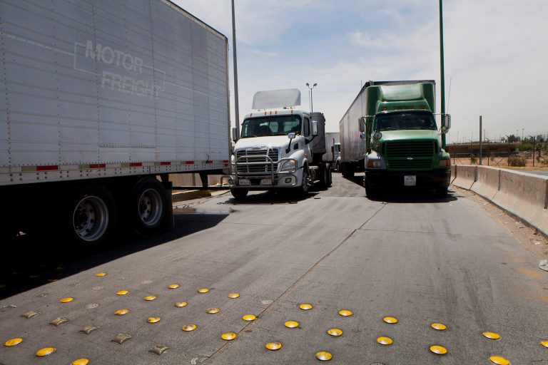 As of January, non-compliant trucks can be fined up to $1,000 per violation per day. (Bloomberg)