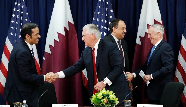 Qatar's Foreign Minister Sheikh Mohammed bin Abdulrahman Al Thani shakes hands with Secretary of State Rex Tillerson, as Qatar's Defense Minister Khalid bin Mohammed al-Attiyah shakes hands with Defense Secretary Jim Mattis, after signing memorandums of understanding during the US Qatar Strategic Dialogue âat the State Department. (AP Photo/Jacquelyn Martin)