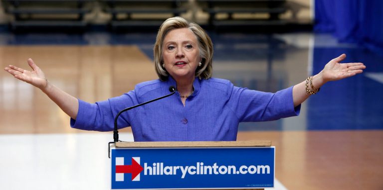 Democratic presidential candidate Hillary Rodham Clinton answers reporters questions about Republican presidential candidate Donald Trump after announcing her college affordability plan, Monday, Aug. 10, 2015, at the high school in Exeter, N.H. (AP Photo/Jim Cole)