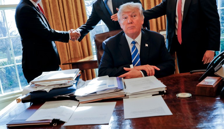 The presence of a button on Trump's desk in the Oval Office was revealed last year. (AP Photo/Pablo Martinez Monsivais, File)