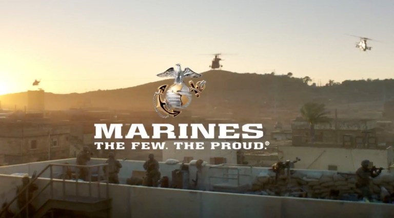 This image from a video released by the U.S. Marine Corps, that will be shown online only Sunday during the Super Bowl and targeting a young, tough, tech-savvy audience for potential recruits who are looking for a challenge. The high-powered, battle-heavy spot shows Marines deploying off ships in amphibious vehicles, dropping bombs from aircraft and hurling a shoulder-launched drone into the air. (U.S. Marine Corps via AP)