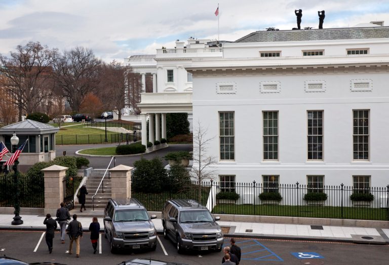 U.S. Secret Service agents from the Counter Sniper Division work on top of the West Wing of the White House in Washington, Thursday, Dec. 11, 2014, , as seen from the Eisenhower Executive Office Building. (AP Photo/Jacquelyn Martin)