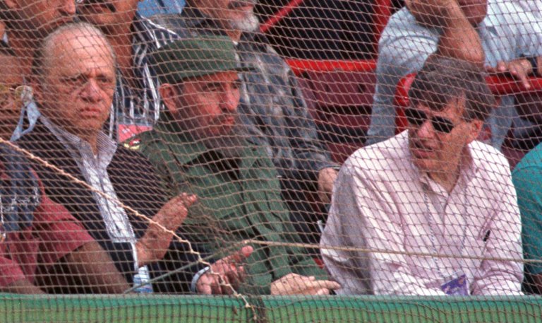 Baltimore Orioles owner Peter Angelos, from left, Cuban leader Fidel Castro and Major League Baseball Commissioner Bud Selig watch a game between the Orioles and the Cuban national team in Havana, Cuba Sunday, March 28, 1999. The Orioles won 3-2 in 11 innings. (AP Photo/Roberto Borea)