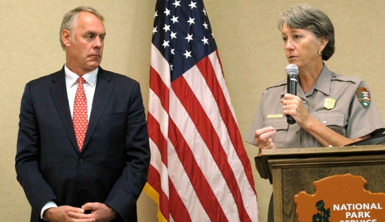 Interior Secretary Ryan Zinke and a National Park superintendent address National Park Service employees. A survey of Park Service employees found nearly two in five have experienced some sort of harassment or discrimination in the workplace. (AP Photo/Felicia Fonseca)