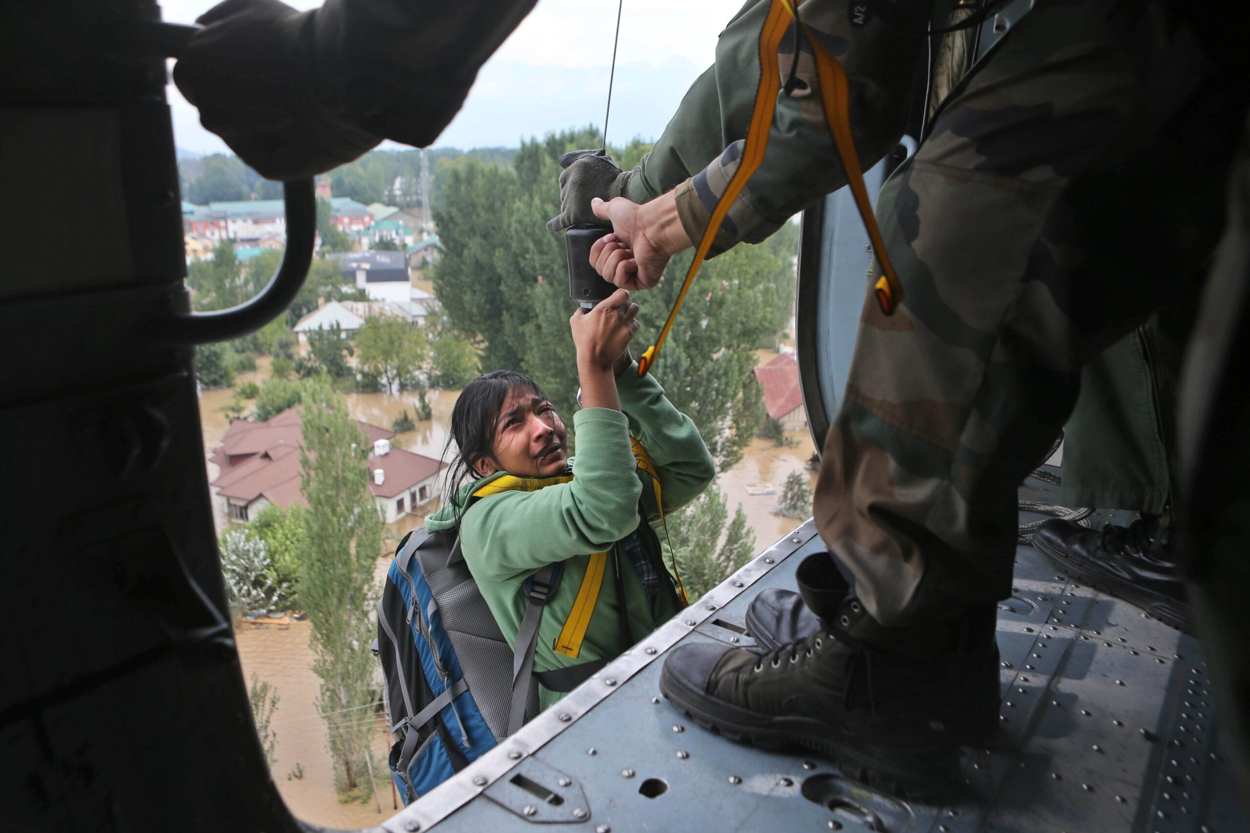 Image of Asia: Lifted to safety in flooded Kashmir