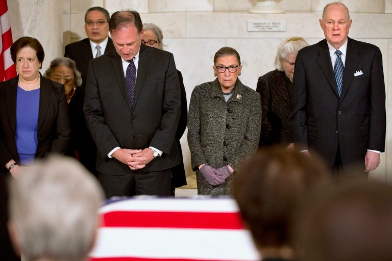 Supreme Court Justices, from left, Elena Kagan, Samuel Anthony Alito, Jr., Ruth Bader Ginsburg, and Anthony Kennedy participate in prayers at a private ceremony in the Great Hall of the Supreme Court in Washington. (AP Photo/Jacquelyn Martin, Pool)
