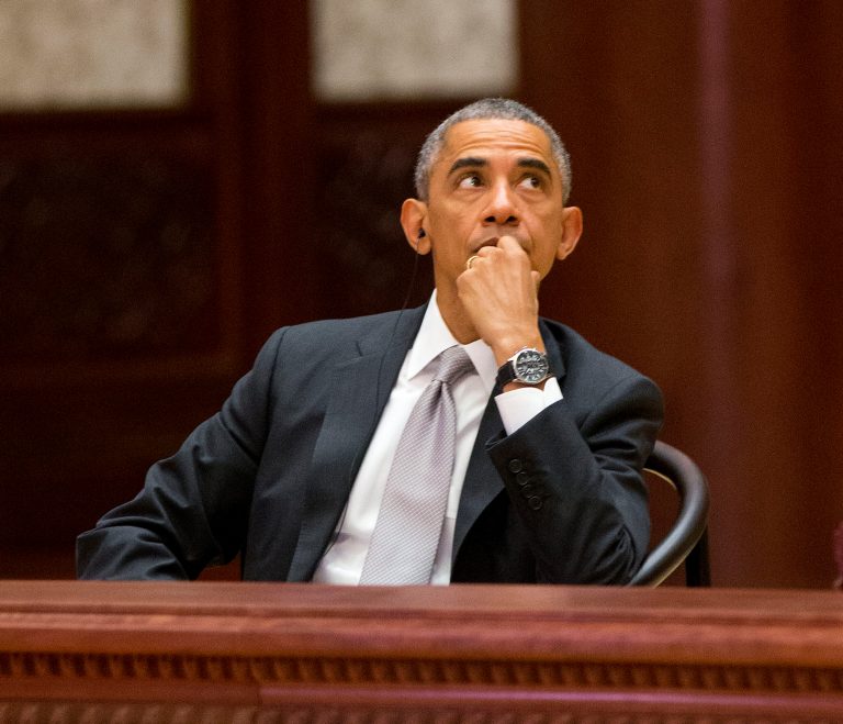 President Obama looks upwards at the the Asia-Pacific Economic Cooperation (APEC) Summit plenary session at the International Convention Center, Yanqi, Tuesday, Nov. 11, 2014 in Beijing. (AP Photo/Pablo Martinez Monsivais, Pool)