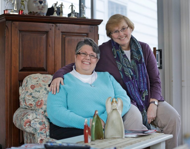 FILE - This Monday Nov. 25, 2013 file photo shows Carol Schall, left, and her partner, Mary Townley, at their home in Richmond, Va. The couple, who were married in California in 2008, decided to join a lawsuit challenging Virginia's ban on same-sex marriage. Almost overnight, Virginia has emerged as a critical state in the nationwide fight to grant gay men and women the right to wed. (AP Photo/Steve Helber, File)