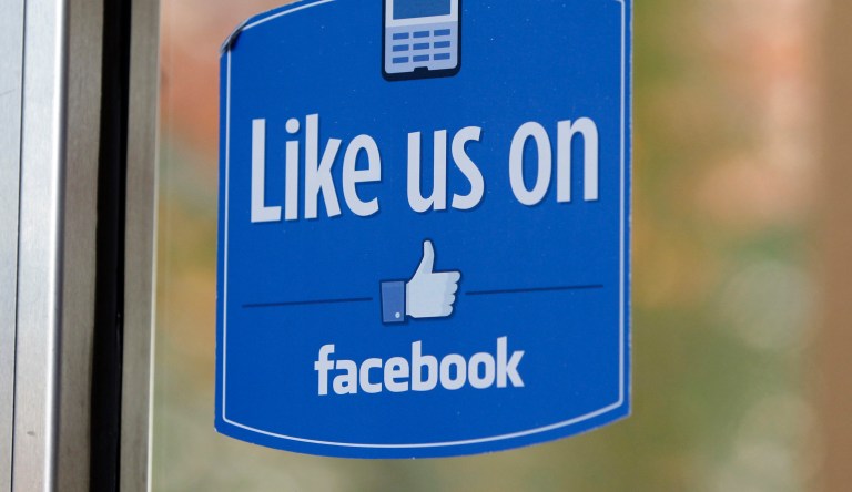 A sign with Facebook's "Like" logo is posted at Facebook headquarters near the office for the company's User Operations Safety Team in Menlo Park, Calif. 