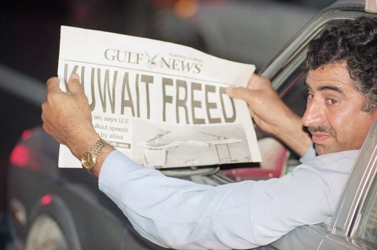 A motorist in Dubai in the U.A.E. holds a special afternoon edition of 