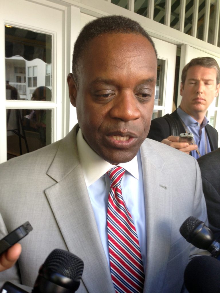 FILE - In a May 30, 2014 file photo, Detroit emergency manager Kevyn Orr speaks with reporters after addressing the Mackinac Policy Conference on Mackinac Island, Mich. The average annual pension for police and fire retirees is $32,000, while most other retired city workers get $19,000 to $20,000. Orr has said pension changes are unfortunate but necessary because two funds are underfunded by billions. If investment performance improves in the years ahead, he said, the cuts could be restored. 