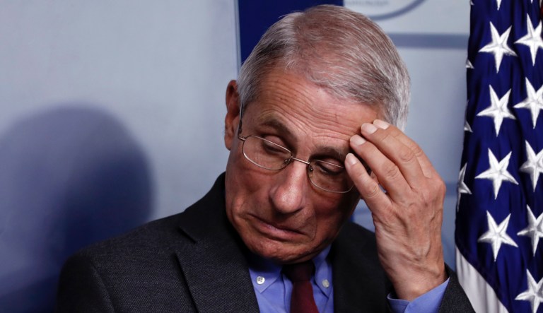 Dr. Anthony Fauci, director of the National Institute of Allergy and Infectious Diseases, listens during a briefing on coronavirus in the Brady press briefing room at the White House, Saturday, March 14, 2020, in Washington.