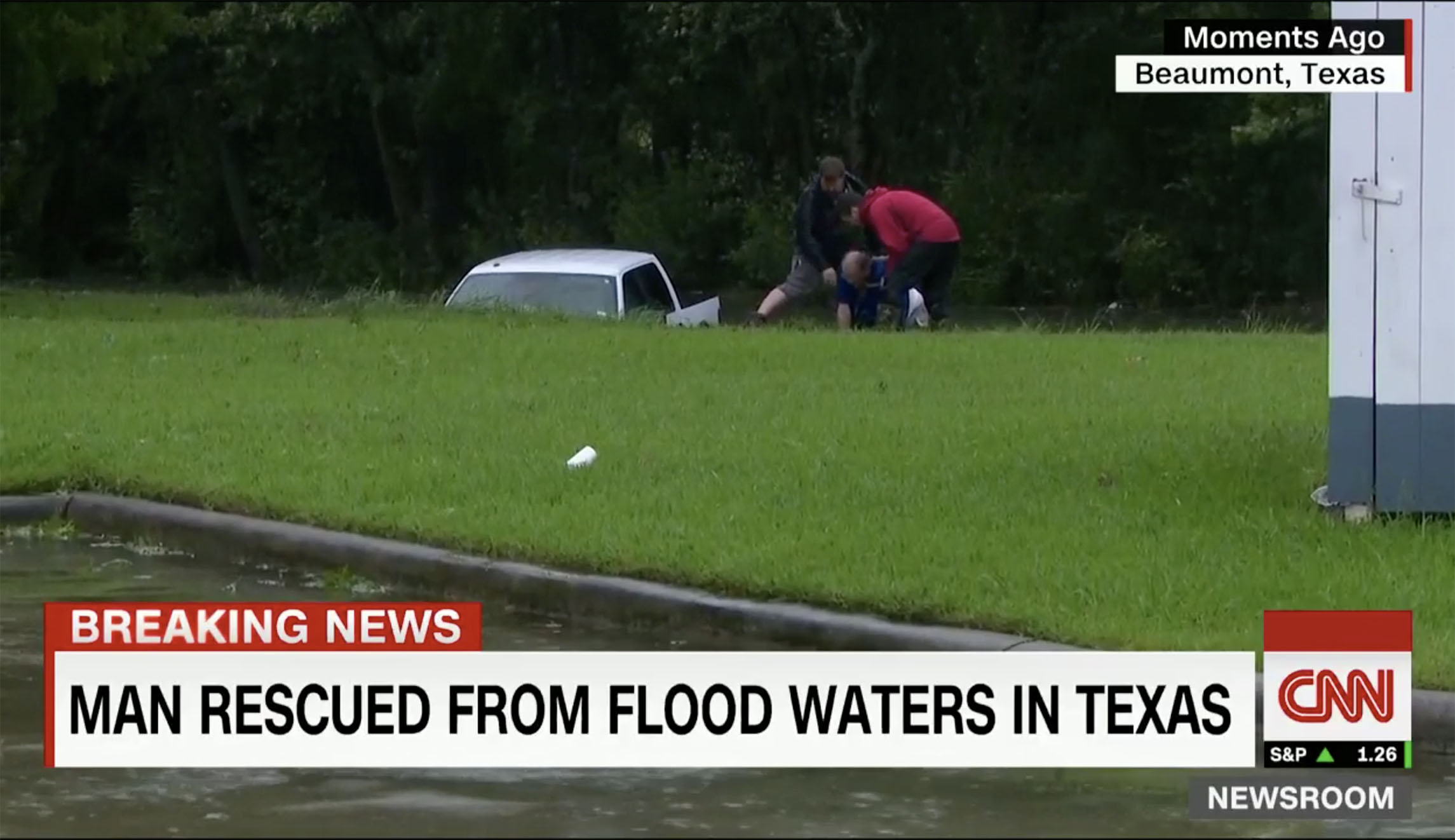 Watch: CNN crew pulls man from flooded truck in Texas
