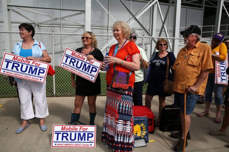 Donald Trump supporters wait in line outside Ladd-Peebles Stadium hours before the start of a rally expected to draw 40,000 people in Mobile, Ala., Friday, Aug. 21, 2015. (Sharon Steinmann/AL.com via AP)