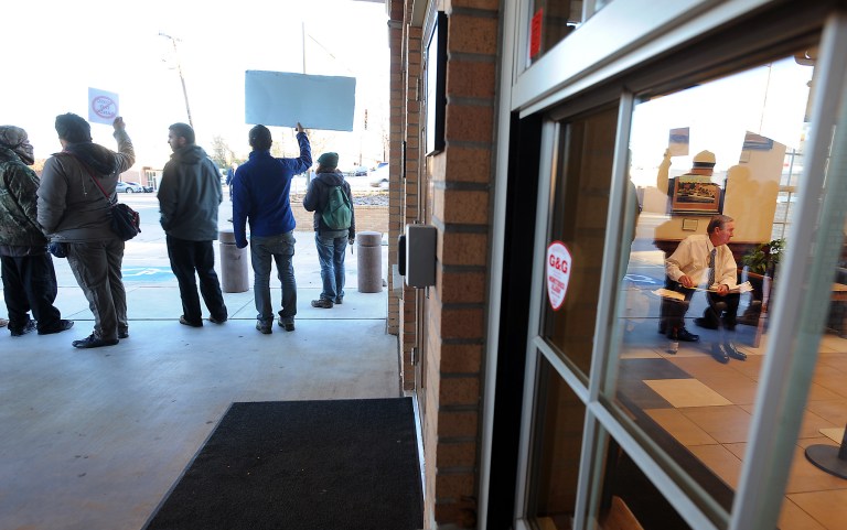   Members of several groups opposed to the planned XL Pipeline protest outside the Nacogdoches County Courthouse in Nacogdoches, Texas, on Thursday, Dec. 13, 2012, as landowner Michael Bishop, in window at right, goes over papers prior to a hearing. An East Texas judge is to hear arguments from the Keystone XL oil pipeline developer to lift a temporary halt on construction on a private property. TransCanada will make its plea to Nacogdoches County Court-at-Law Judge Jack Sinz. TransCanada is building part of an oil pipeline designed to carry tar sands oil from Canada to the Gulf Coast. The property rights dispute is the latest legal battle to plague a project that has encountered numerous obstacles nationwide. Texas landowner Michael Bishop obtained a temporary restraining order from Sinz last Friday, arguing that TransCanada lied to Texans when it said it would be using the Keystone XL pipeline to transport crude oil. (AP Photo/The Daily Sentinel, Andrew D. Brosig) MANDATORY CREDIT  
