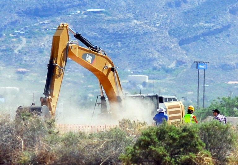 Crews begin digging at the old Alamogordo, N.M., landfill on Friday April 25, 2014, to search for copies of the Atari game 