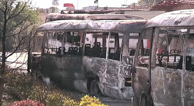   This image made from video released by UNSMIS, the UN observer mission in Syria and accessed Saturday, June 9, 2012, purports to show destroyed buses after overnight fighting in Damascus, Syria. In Damascus, residents spoke about a night of shooting and explosions in the worst violence Syria's capital has seen since the uprising against President Bashar Assad's regime began 15 months ago.(AP Photo/UNSMIS via AP video) THE ASSOCIATED PRESS CANNOT INDEPENDENTLY VERIFY THE CONTENT, DATE, LOCATION OR AUTHENTICITY OF THIS MATERIAL  