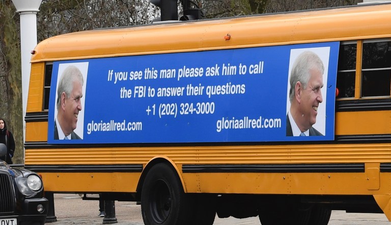 A yellow school bus with a message for the Britain's Prince Andrew, from US lawyer Gloria Allred, drives along The Mall towards Buckingham Palace in London Friday Feb. 21, 2020.