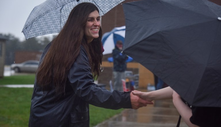 Danica Roem campaigns as voters take to the ballot boxes at Gainesville Middle School on Tuesday, Nov. 7, 2017, in Gainesville, Va. A survey said 80 percent of Republicans believe a person's gender is determined by their sex at birth, but 64 percent of Democrats disagreed, and said a person's gender can be different. (Jahi Chikwendiu /The Washington Post via AP)