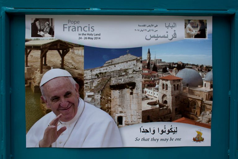 In this Monday, May 12, 2014 photo, a welcome poster with a picture of Pope Francis is posted at a street near the Church of the Nativity, one of the stops of Pope Francis during his upcoming visit in the Holy Land at the end of this month, in the West Bank city of Bethlehem. Israel's internal security agency said it fears there could be more anti-Christian vandalism attacks, and local Vatican officials have urged Israel to safeguard Christian holy sites ahead of the pope's visit at the end of the month. (AP Photo/Nasser Nasser)
