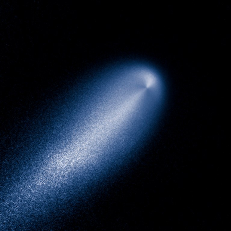 In this photo provided by NASA, a contrast-enhanced image produced from the Hubble images of comet ISON taken April 23, 2013 reveals the subtle structure in the inner coma of the comet. In this computer-processed view, the Hubble image has been divided by a computer model coma that decreases in brightness proportionally to the distance from the nucleus, as expected for a comet that is producing dust uniformly over its surface. ISON's coma shows enhanced dust particle release on the sunward-facing side of the comet's nucleus, the small, solid body at the core of the comet. This information is invaluable for determining the comet's shape, evolution, and spin of the solid nucleus. (AP Photo/NASA)