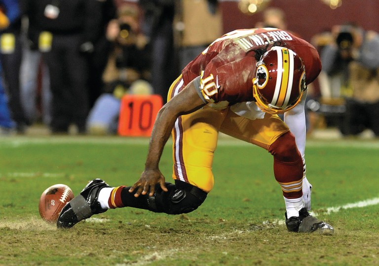 Redskins quarterback Robert Griffin III still can't do explosive sprinting or cutting since injuring his knee in a playoff game against the Seahawks in January. (Photo: Richard Lipski/AP)