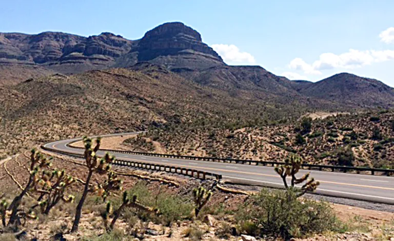 CORRECTS RESERVATION LOCATION TO NORTHWEST ARIZONA- This undated photo provided by Fann Contracting, Inc. shows a newly-paved stretch of road leading to the Grand Canyon Skywalk on the Hualapai Indian Reservation in northwestern Arizona. Known as the Diamond Bar Road, the once rugged, nine-mile washboard road now is completely paved after years of battles that included a dude rancher charging tourists to cross his property. A ceremony is planned Tuesday, Aug. 12, 2014 to mark completion of the project. (AP Photo/Fann Contracting, Inc.)