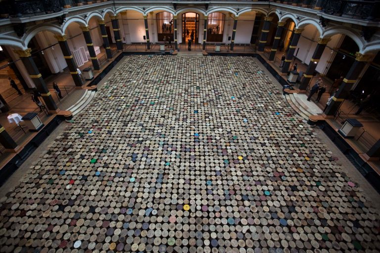 The artwork 'Stools' by Chinese artist  Ai Weiwei is displayed in the atrium of the Martin-Gropius-Bau Museum at the exhibition 'Evidence' in Berlin, Wednesday, April 2, 2014. The museum said with the exhibition 'Evidence' they present the largest  exhibition of Ai Weiwei . The exhibition will be open from April 3 until July 7,  2014. (AP Photo/Markus Schreiber)