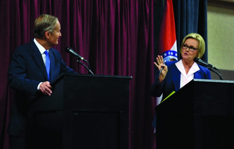 Democratic Sen. Claire McCaskill, right, speaks as Republican challenger Rep. Todd Akin listens during the first debate in the Missouri Senate race Friday, Sept. 21, 2012, in Columbia, Mo. (AP Photo/Jeff Roberson)
