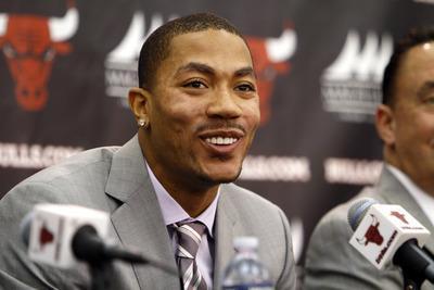Charles Cherney/AP
Reigning MVP Derrick Rose signed a five-year,$94.8 million maximum contract extension.
