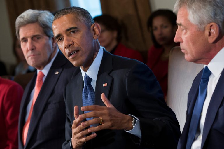 Secretary of State John Kerry, left, and Secretary of Defense Chuck Hagel, right, look on as President Barack Obama delivers remarks on his budget proposal during a cabinet meeting in the Cabinet Room of the White House, on Tuesday, Feb. 3, 2015, in Washington. (AP Photo/Evan Vucci)