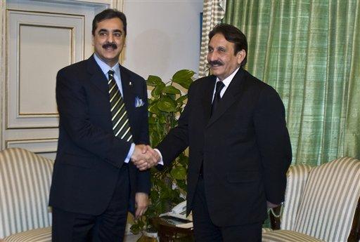 In this picture taken on Feb. 17, 2010, Pakistan's Chief Justice Iftikhar Mohammed Chaudhry, right, shakes hand with Prime Minister Yousuf Raza Gilani prior to their meeting in Islamabad, Pakistan. Pakistan's Supreme Court ramped up the pressure on the nation's beleaguered government Monday, Jan. 16, 2012, beginning contempt proceedings against the Gilani for failing to carry out its order to reopen a corruption case against the president. (AP Photo/Anjum Naveed)