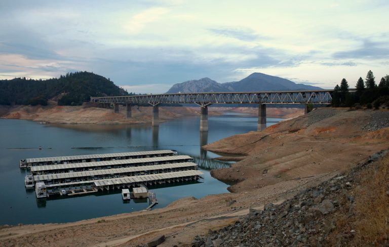 In this photo taken Sept. 17, 2014, house boats are docked at Lake Shasta's Bay Bridge resort near Redding, Calif.  After three years of drought the water level at the lake has dramatically receded.  California's third year of drought ends Tuesday Sept. 30 and California Department of Water Resource Director Mark Cowin said it is essential to use water sparingly as the state faces the possibility of a fourth dry winter.(AP Photo/Rich Pedroncelli)