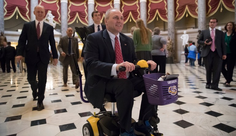 Scalise challenged Rep. Sam Johnson, R-Texas, to race around the Capitol building's famous rotunda in their motorized scooters on Wednesday. (AP Photo/J. Scott Applewhite)