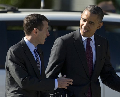 President Barack Obama talks with senior White House adviser David Plouffe as they leave the Kingsmill Resort, Tuesday, Oct. 16, 2012, in Williamsburg, Va., enroute to New York and presidential debate. (AP Photo/Carolyn Kaster)