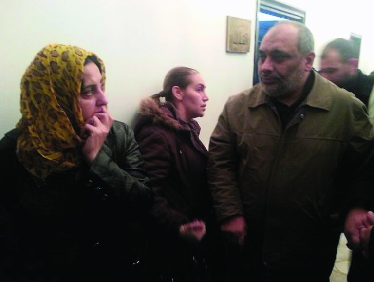 In this photo provided by the Turkish Islamic aid group IHH, the group's chairman, Bulent Yildirim right, speaks with freed Syrian prisoners in Damascus, Syria, Wednesday, Jan. 9, 2013. Syrian rebels freed 48 Iranians held captive since August, Iranian state TV reported Wednesday, part of what appeared to be the first major prisoner swap of the civil war. The deal, reportedly coordinated by the IHH, will also involve the release of more than 2,000 Syrians held by Bashar Assad's regime, Turkey's state-run agency Anadolu Agency reported. (AP Photo/IHH)