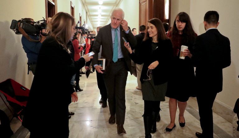 Senate Majority Whip Sen. John Cornyn, R-Texas, (pictured center) is cosponsoring a bill with Sen. Chris Murphy, D-Conn., and more than a dozen other senators from both parties. The bill would improve the nation's background check system used for scrutinizing most firearms purchases. However, House Republicans are likely to oppose it unless they can add language allowing concealed carry permit holders to legally bring their weapons to other states. (AP Photo/Pablo Martinez Monsivais)