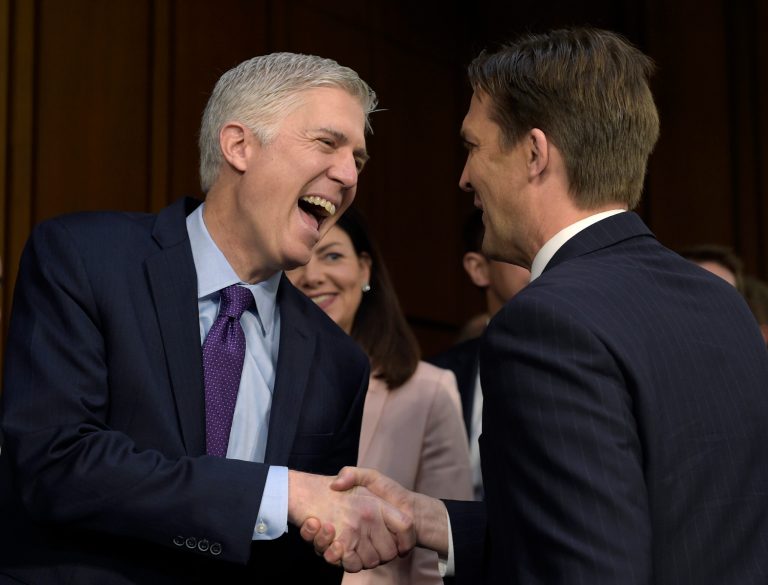 Supreme Court Justice nominee Neil Gorsuch, left, shares a laugh with Senate Judiciary Committee member Sen. Ben Sasse, R-Neb., as he arrives on Capitol Hill in Washington. (AP Photo/Susan Walsh)